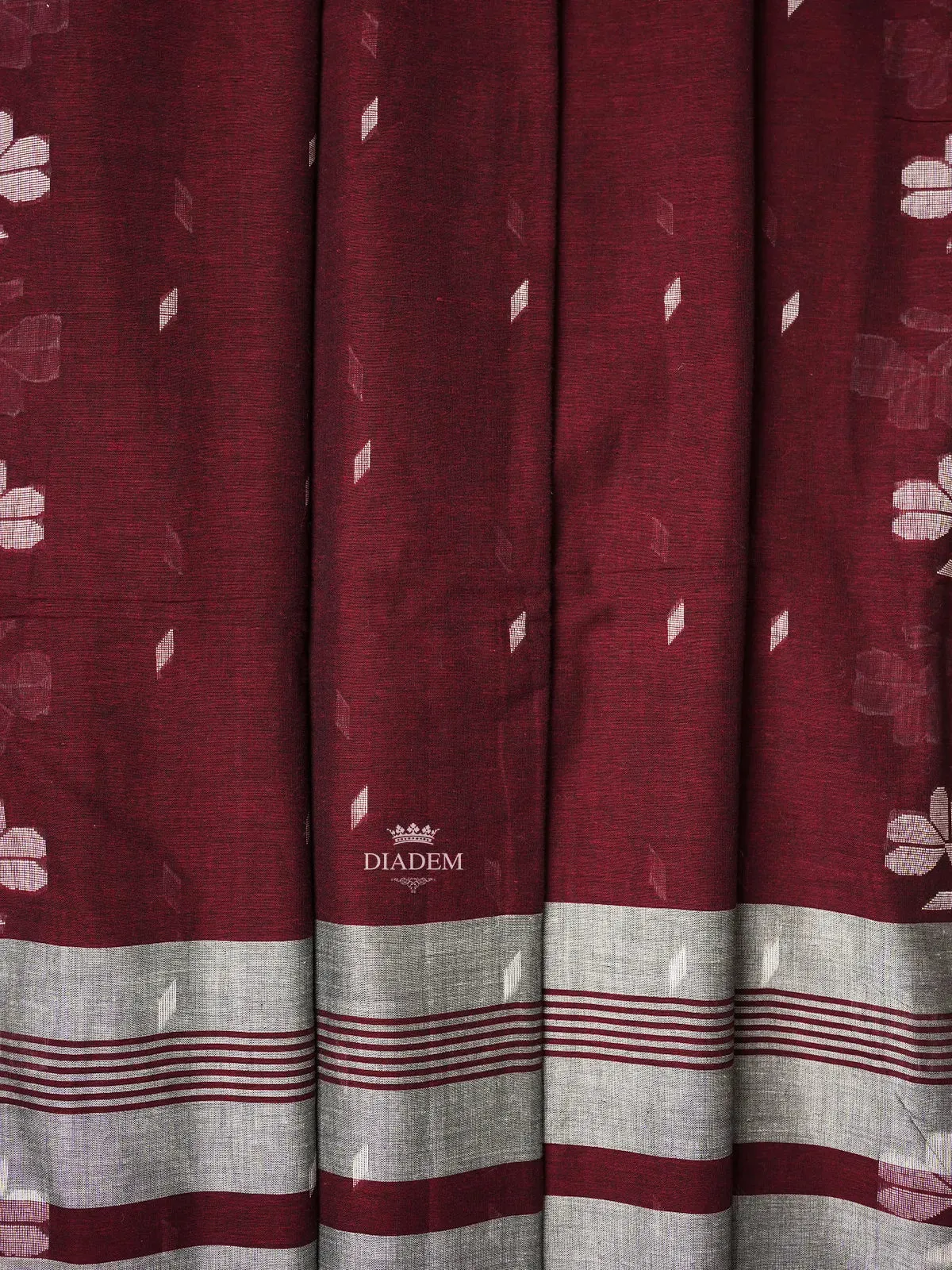 Burgundy Linen Cotton Saree with Floral Designs on the Body with Designed Border